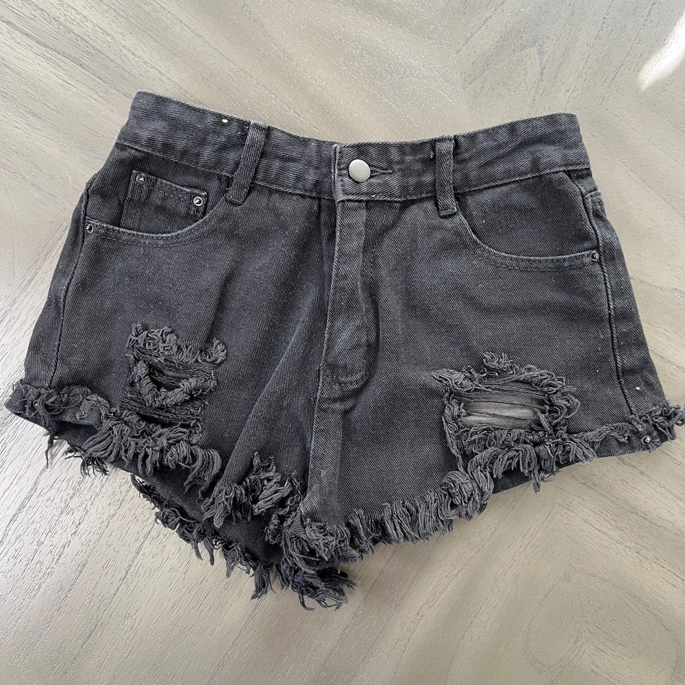 Black high-waisted distressed denim shorts